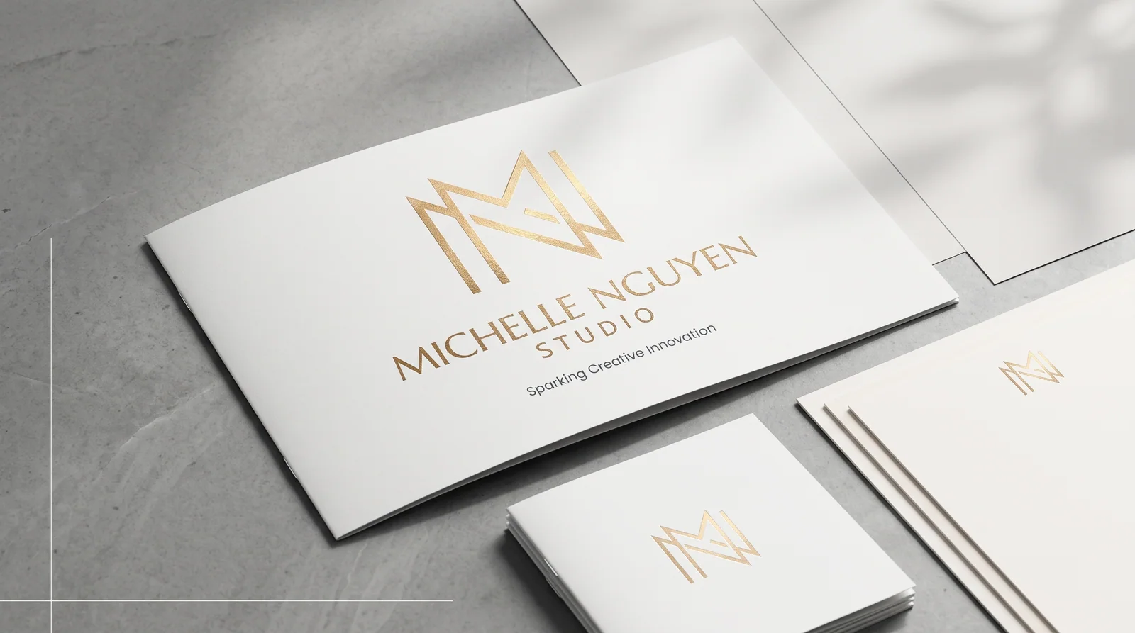 Michelle Nguyen Studio gold identity applied to premium white business cards